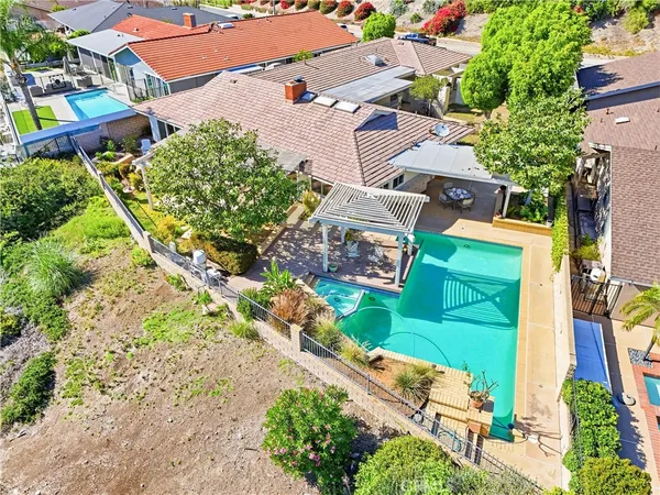 an aerial view of residential houses with outdoor space