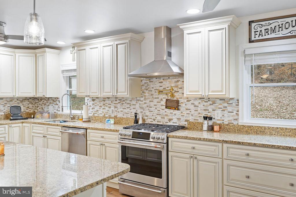 997 Mt Zion Marlboro Road Lothian, MD 20711 - Photo 19 of 58 a kitchen with a sink stove and cabinets