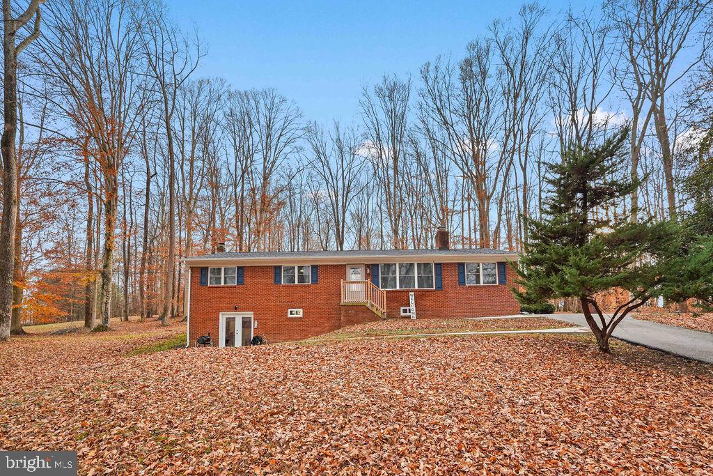 997 Mt Zion Marlboro Road Lothian, MD 20711 - Photo 2 of 58 a front view of a house with a yard