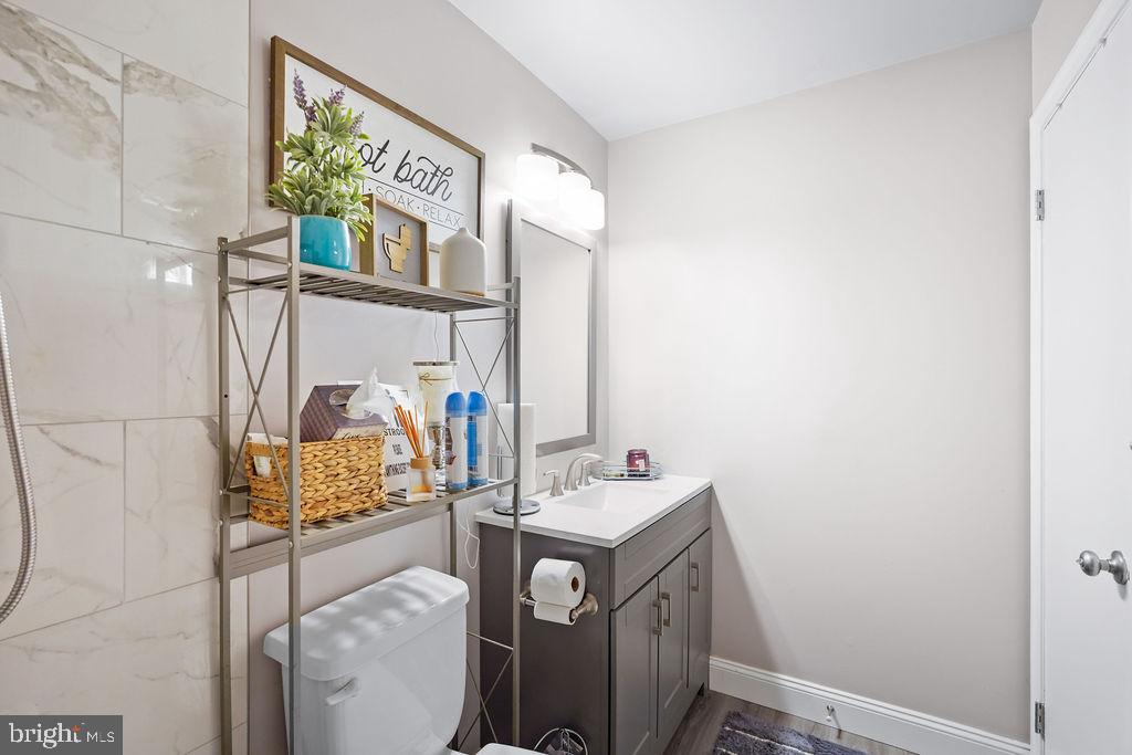 997 Mt Zion Marlboro Road Lothian, MD 20711 - Photo 29 of 58 a bathroom with a sink mirror and vanity