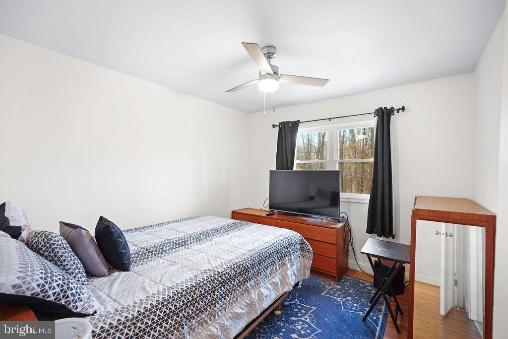 997 Mt Zion Marlboro Road Lothian, MD 20711 - Photo 31 of 58 a bedroom with a bed and wooden floor