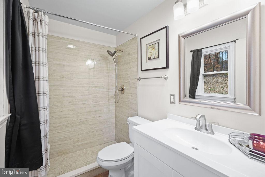 997 Mt Zion Marlboro Road Lothian, MD 20711 - Photo 33 of 58 a bathroom with a sink toilet and shower