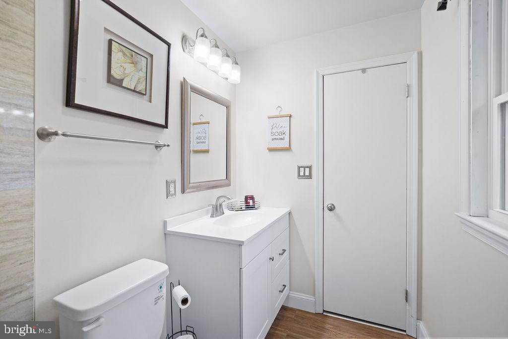 997 Mt Zion Marlboro Road Lothian, MD 20711 - Photo 35 of 58 a bathroom with a toilet sink and mirror