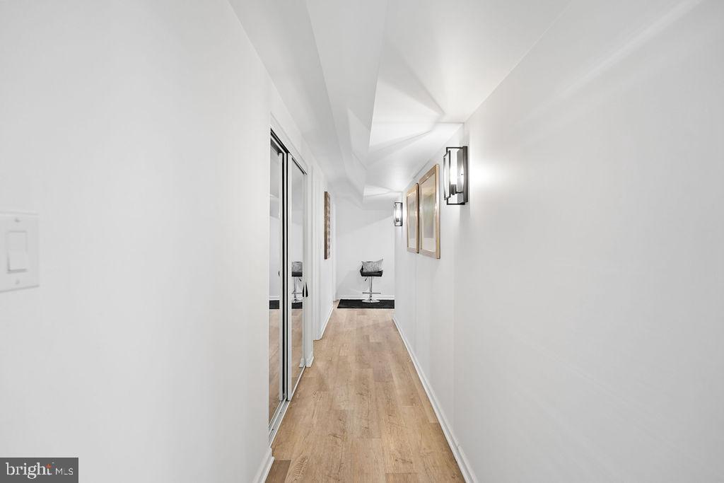 997 Mt Zion Marlboro Road Lothian, MD 20711 - Photo 36 of 58 a view of a hallway with wooden floor and staircase