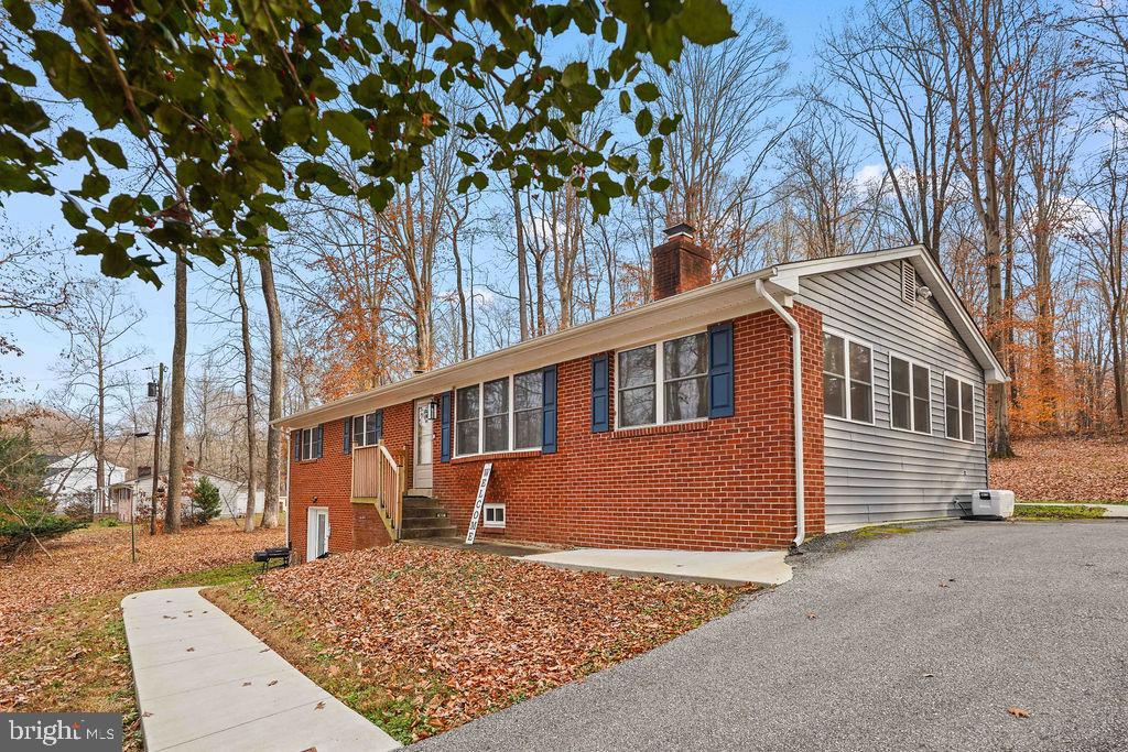 997 Mt Zion Marlboro Road Lothian, MD 20711 - Photo 5 of 58 a front view of a house with a tree