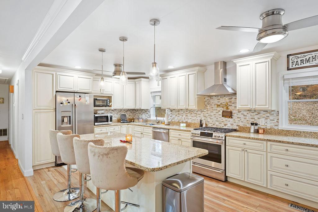 997 Mt Zion Marlboro Road Lothian, MD 20711 - Photo 10 of 58 a kitchen with appliances a sink and cabinets