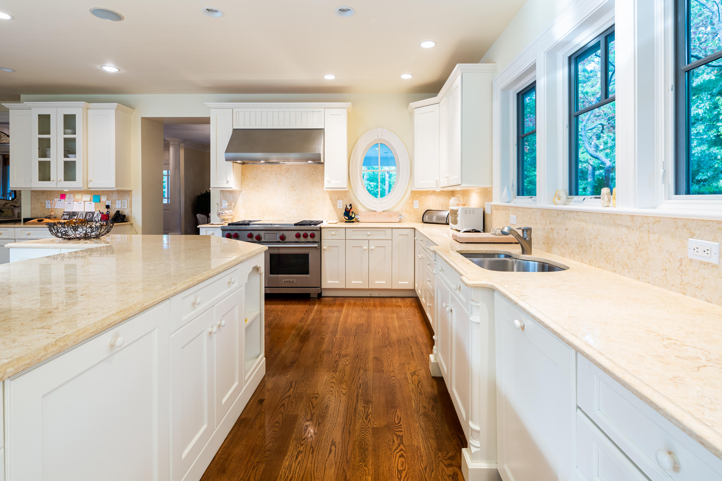 350 Windswept Way Osterville, MA 02655 - Photo 14 of 47 a large kitchen with stainless steel appliances granite countertop a lot of counter space and wooden floors