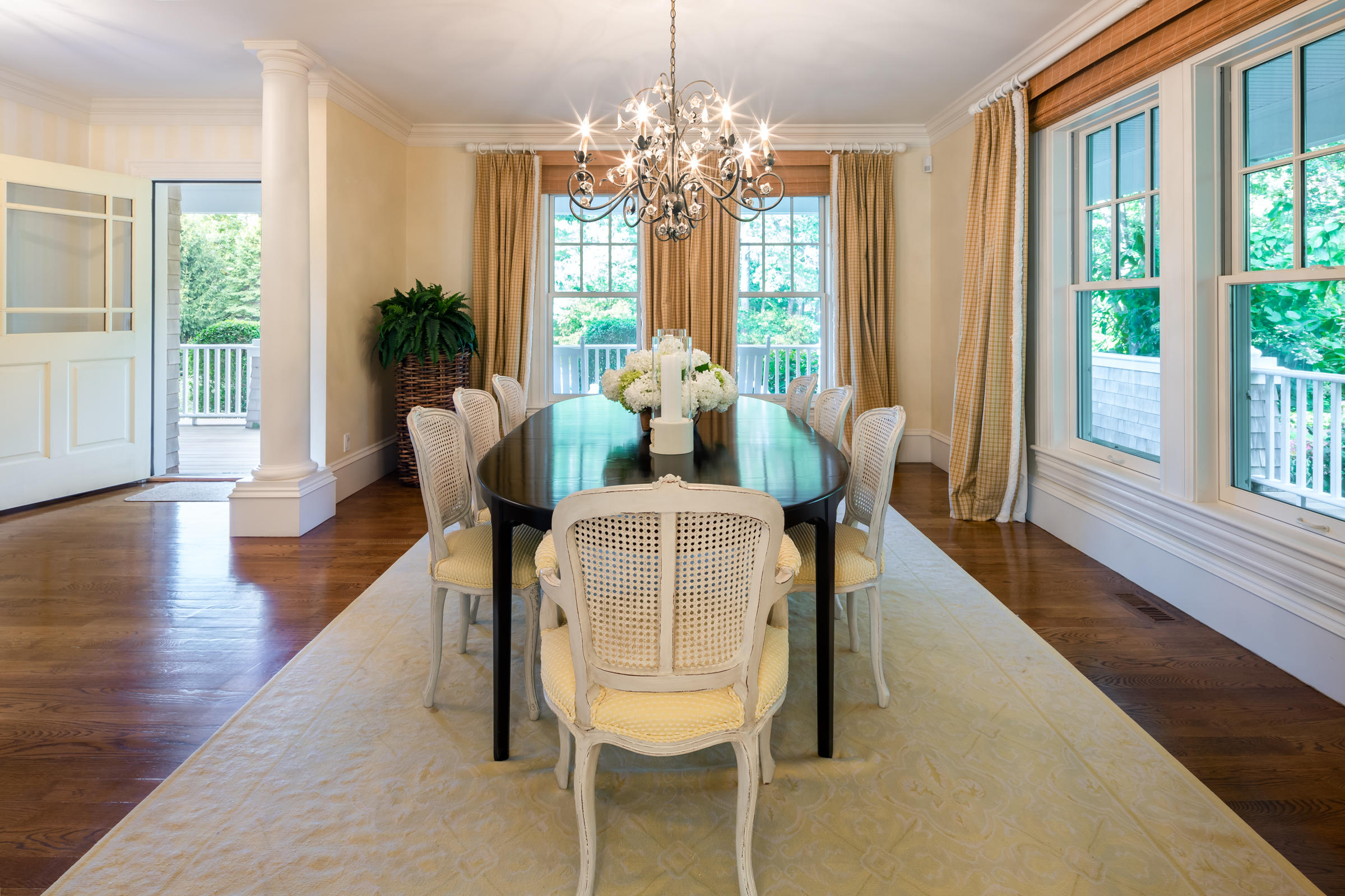 350 Windswept Way Osterville, MA 02655 - Photo 19 of 47 a dining room with furniture a chandelier and wooden floor