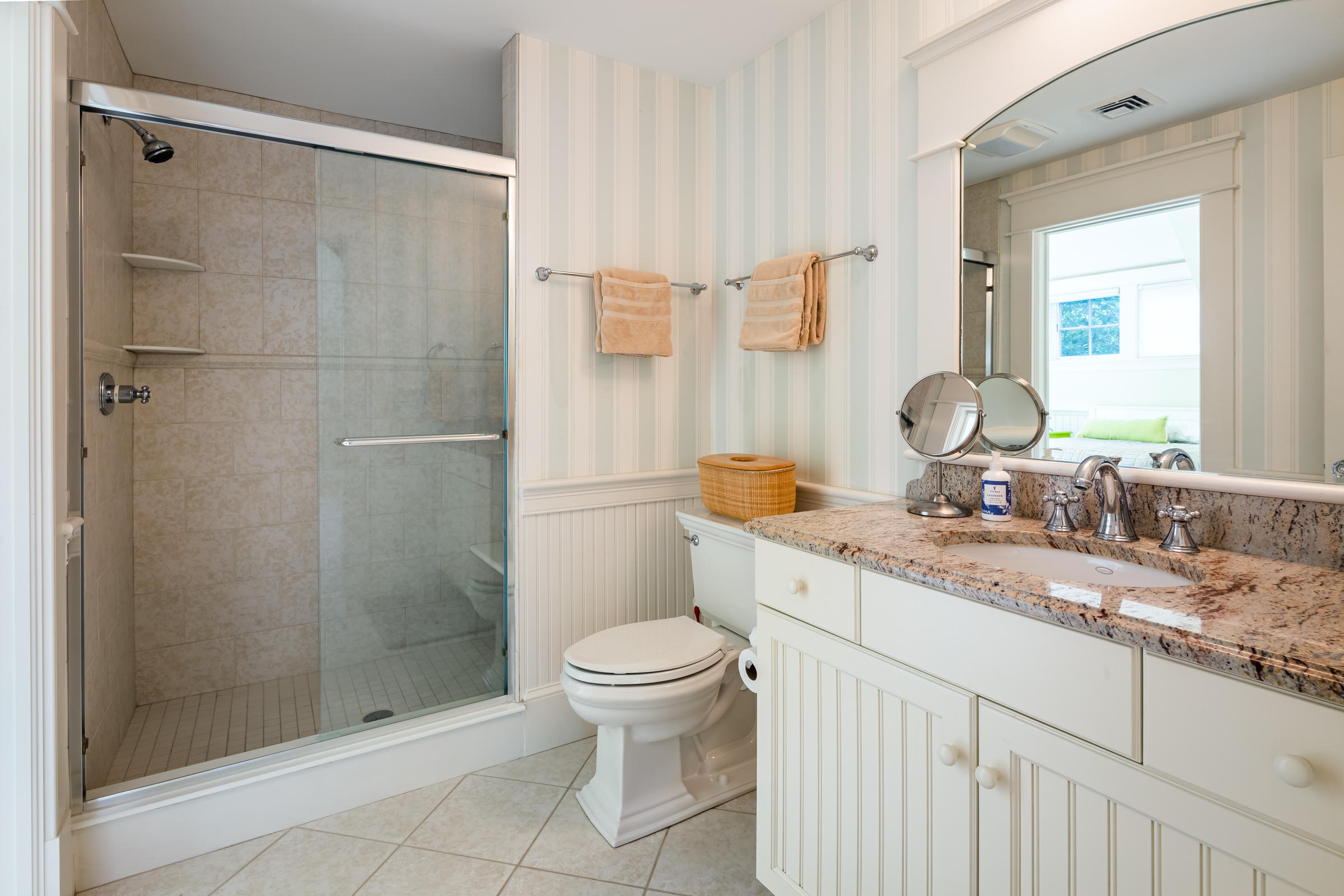 350 Windswept Way Osterville, MA 02655 - Photo 36 of 47 a bathroom with a granite countertop sink a toilet and shower