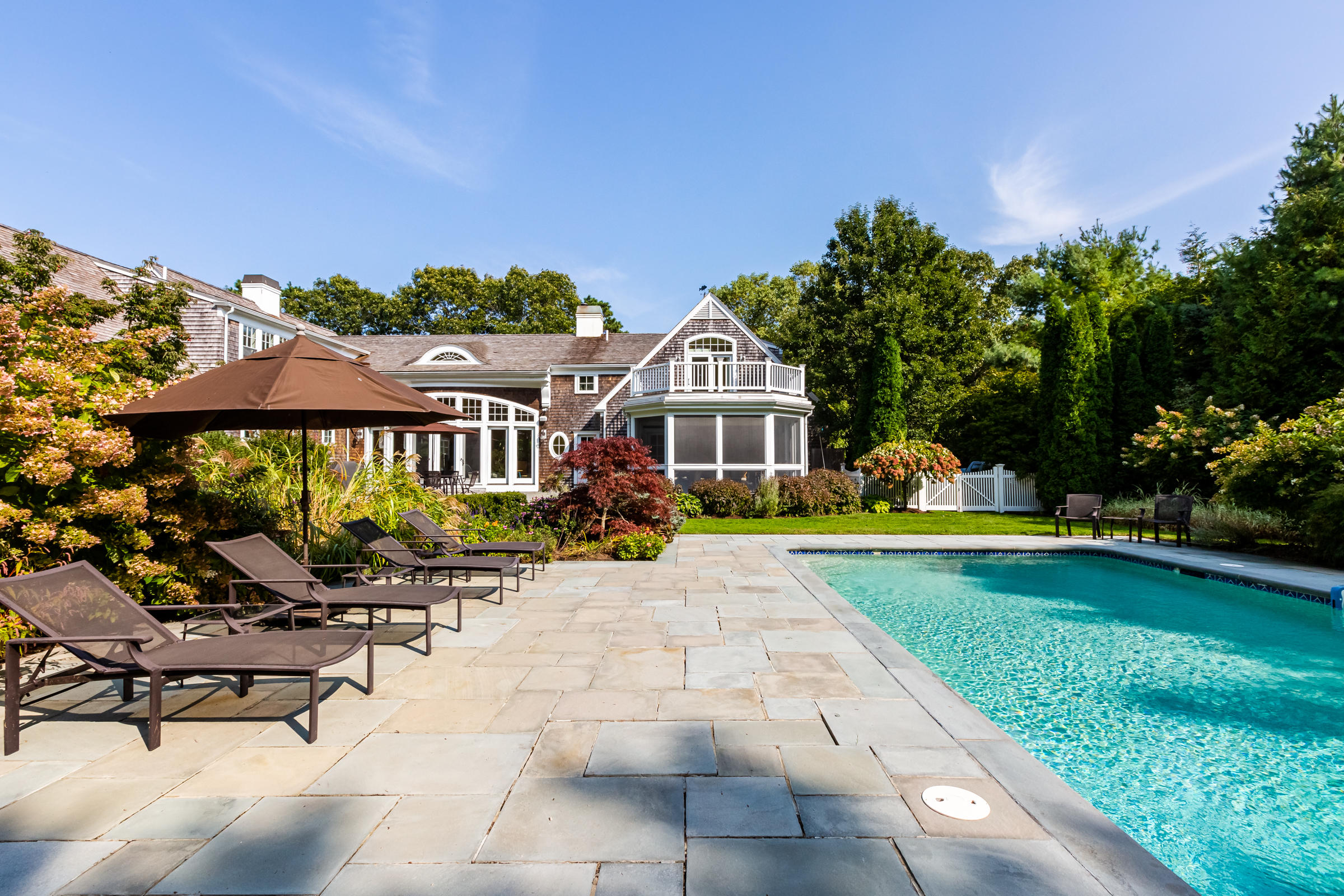350 Windswept Way Osterville, MA 02655 - Photo 39 of 47 a view of a house with backyard porch and sitting area