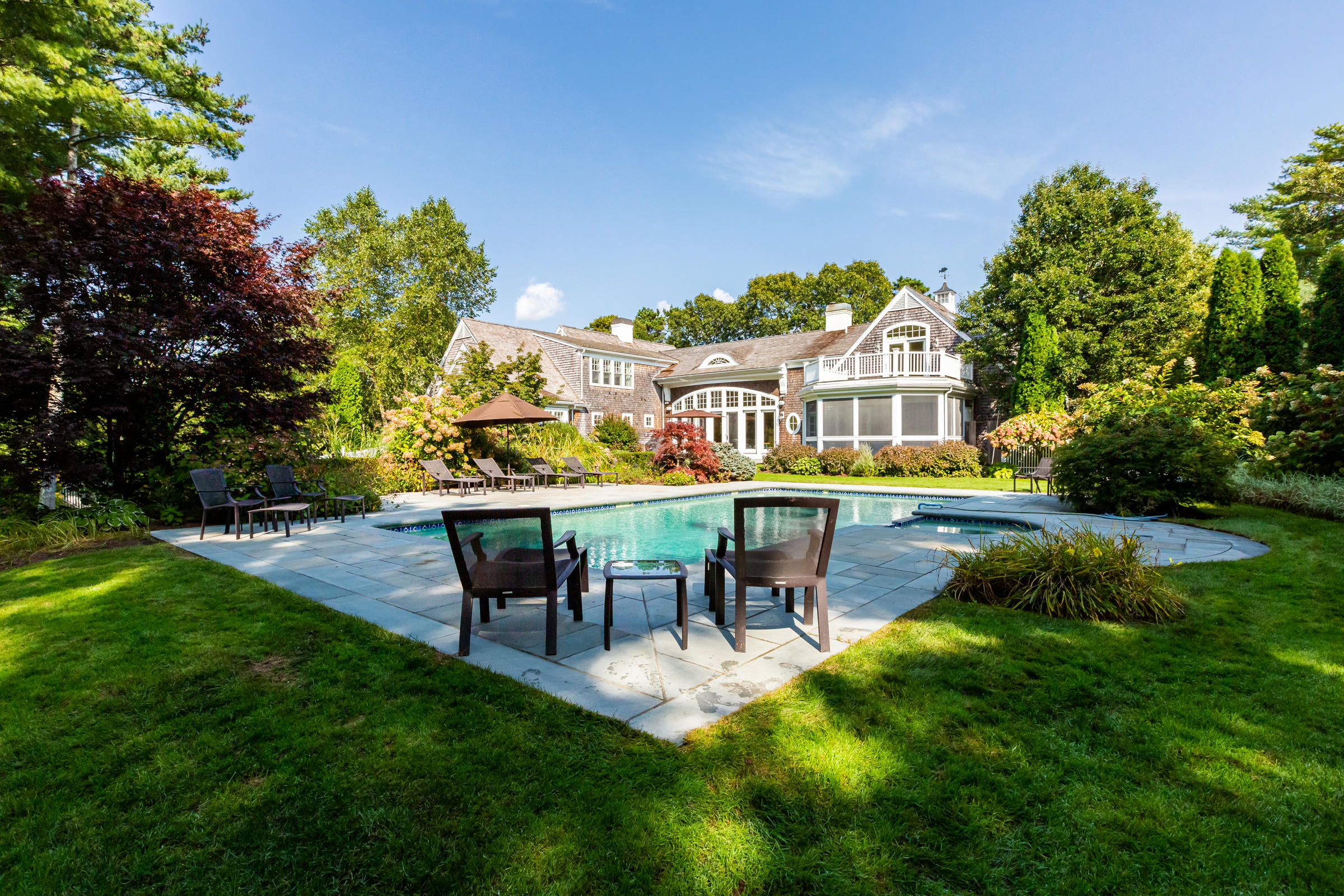 350 Windswept Way Osterville, MA 02655 - Photo 40 of 47 a view of a house with pool and sitting area