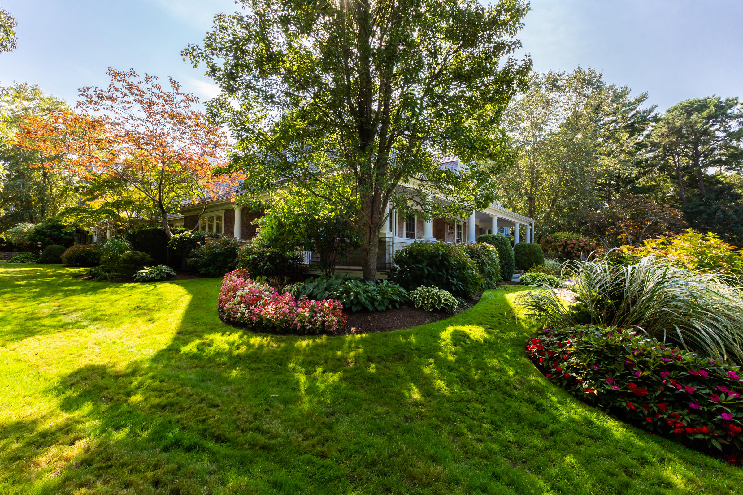 350 Windswept Way Osterville, MA 02655 - Photo 42 of 47 a view of a swimming pool with a garden