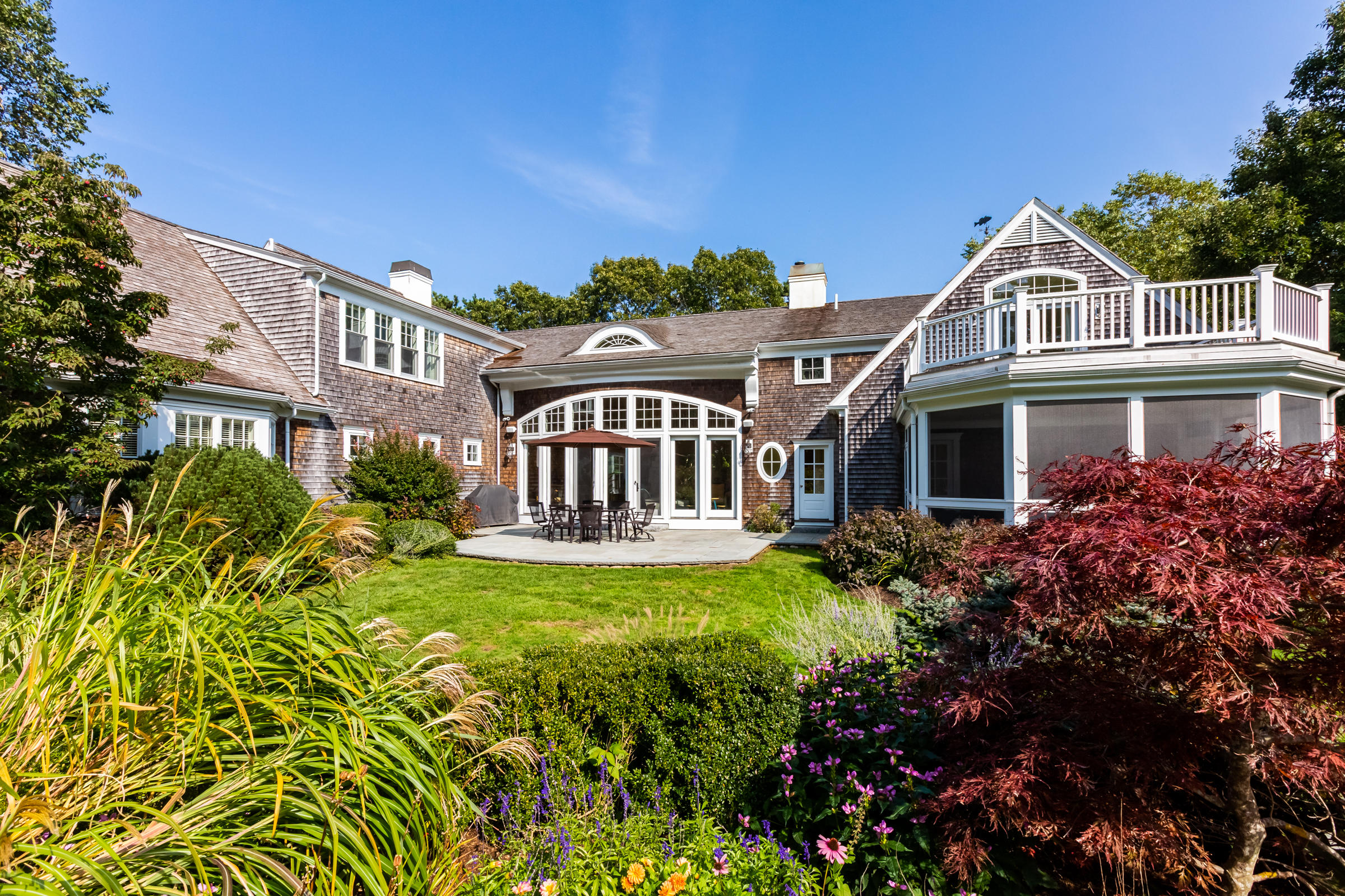350 Windswept Way Osterville, MA 02655 - Photo 43 of 47 a front view of a house with a garden