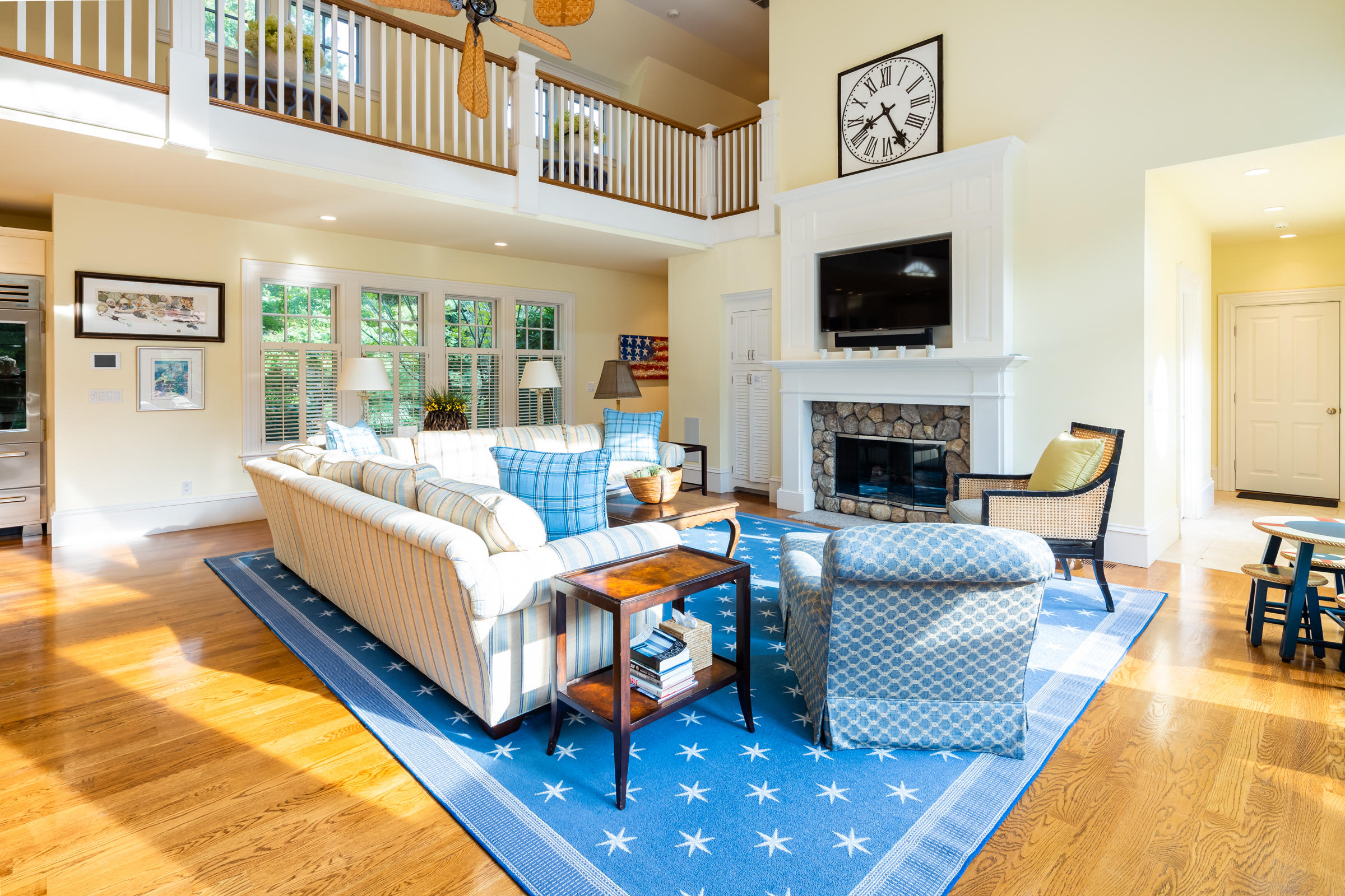 350 Windswept Way Osterville, MA 02655 - Photo 8 of 47 a living room with furniture a flat screen tv and a fireplace