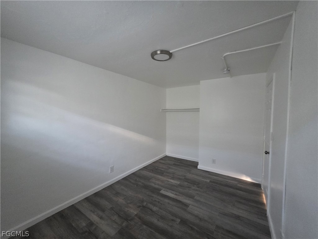 3033 2nd Street, Unit 2 Fort Myers, FL 33916 - Photo 3 of 9 a view of a room with wooden floor