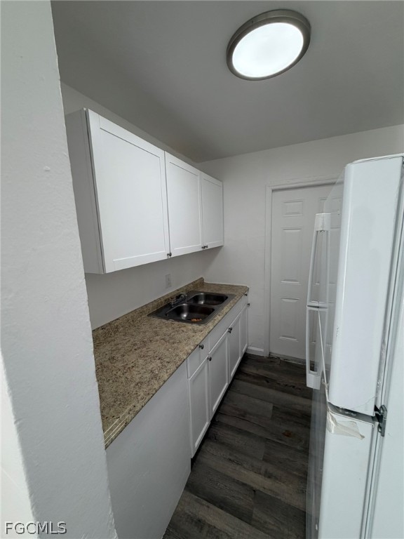 3033 2nd Street, Unit 2 Fort Myers, FL 33916 - Photo 9 of 9 a kitchen with sink and cabinets