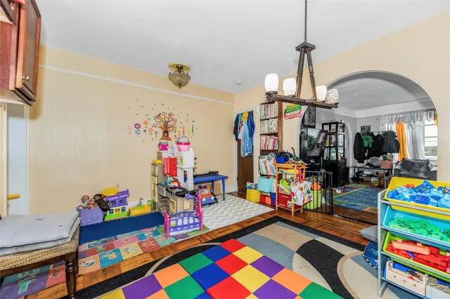 a bed room with furniture and a flat screen tv