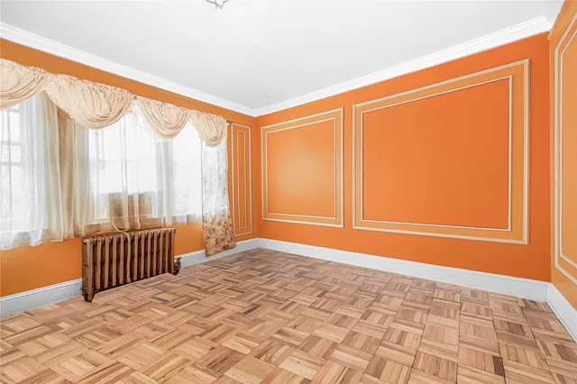 a view of an empty room and a window