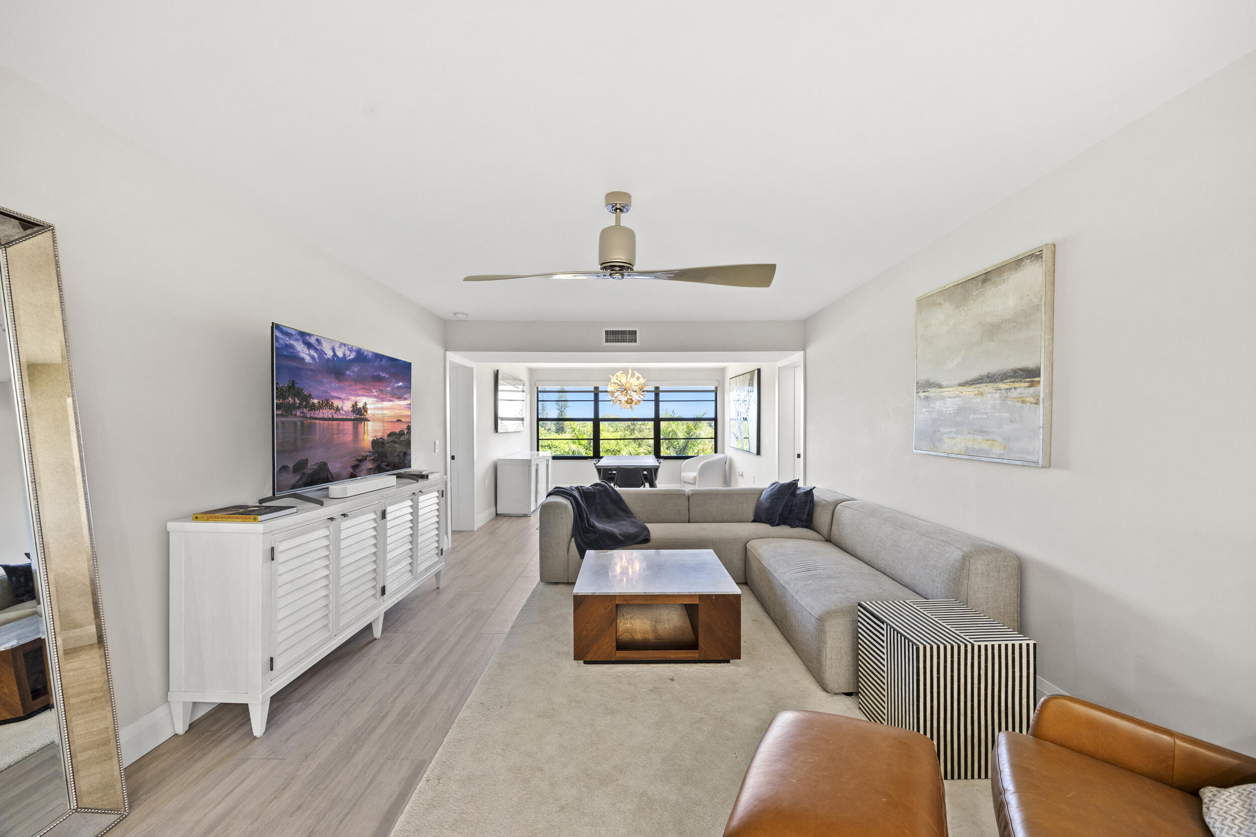 6061 Balboa Circle, Unit 403 Boca Raton, FL 33433 - Photo 14 of 44 a living room with furniture and a flat screen tv