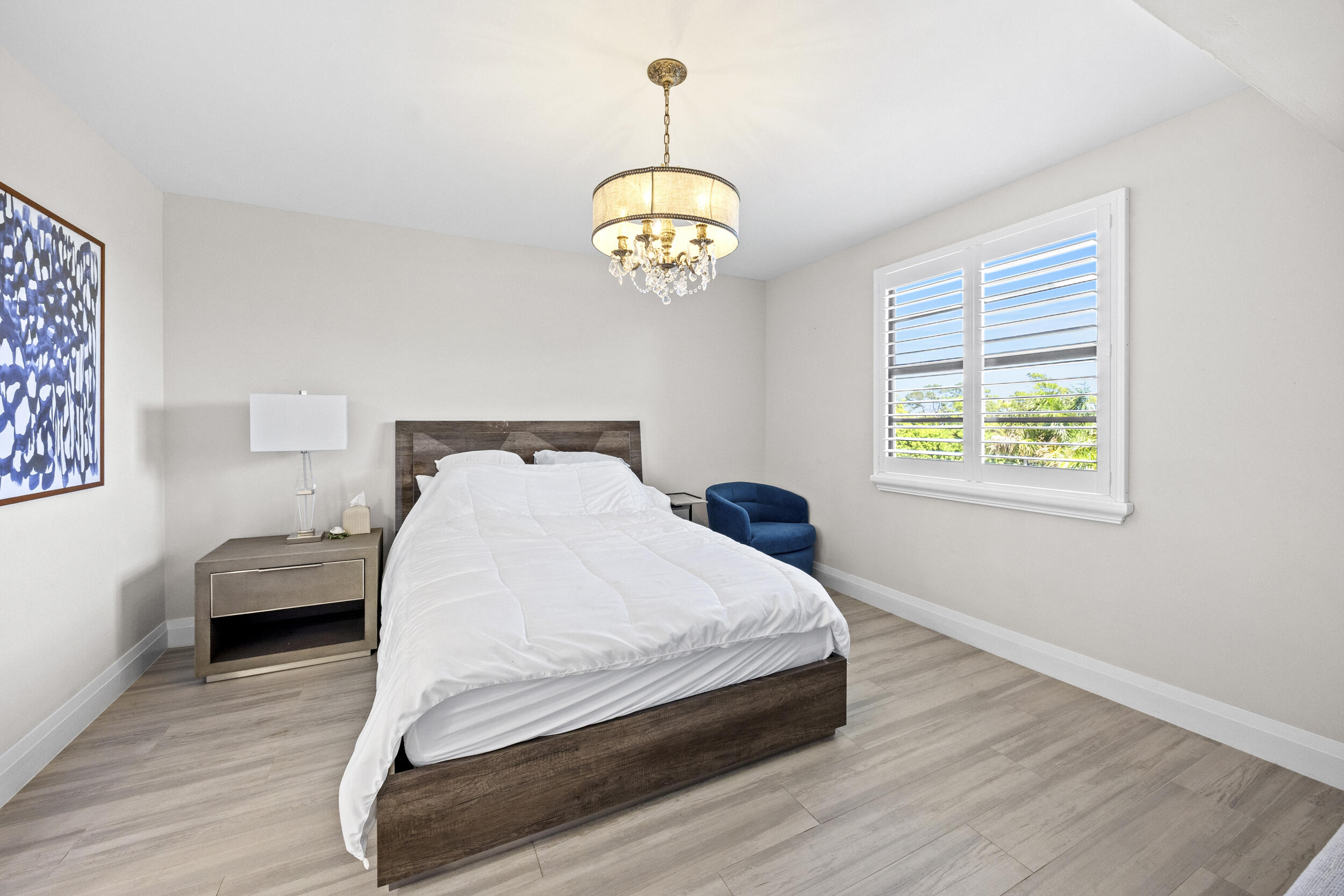 6061 Balboa Circle, Unit 403 Boca Raton, FL 33433 - Photo 22 of 44 a bedroom with bed and window