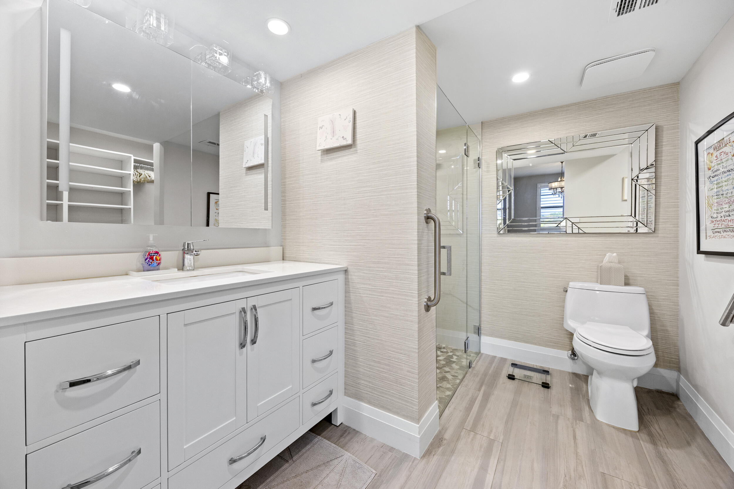 6061 Balboa Circle, Unit 403 Boca Raton, FL 33433 - Photo 25 of 44 a bathroom with a sink a toilet and shower