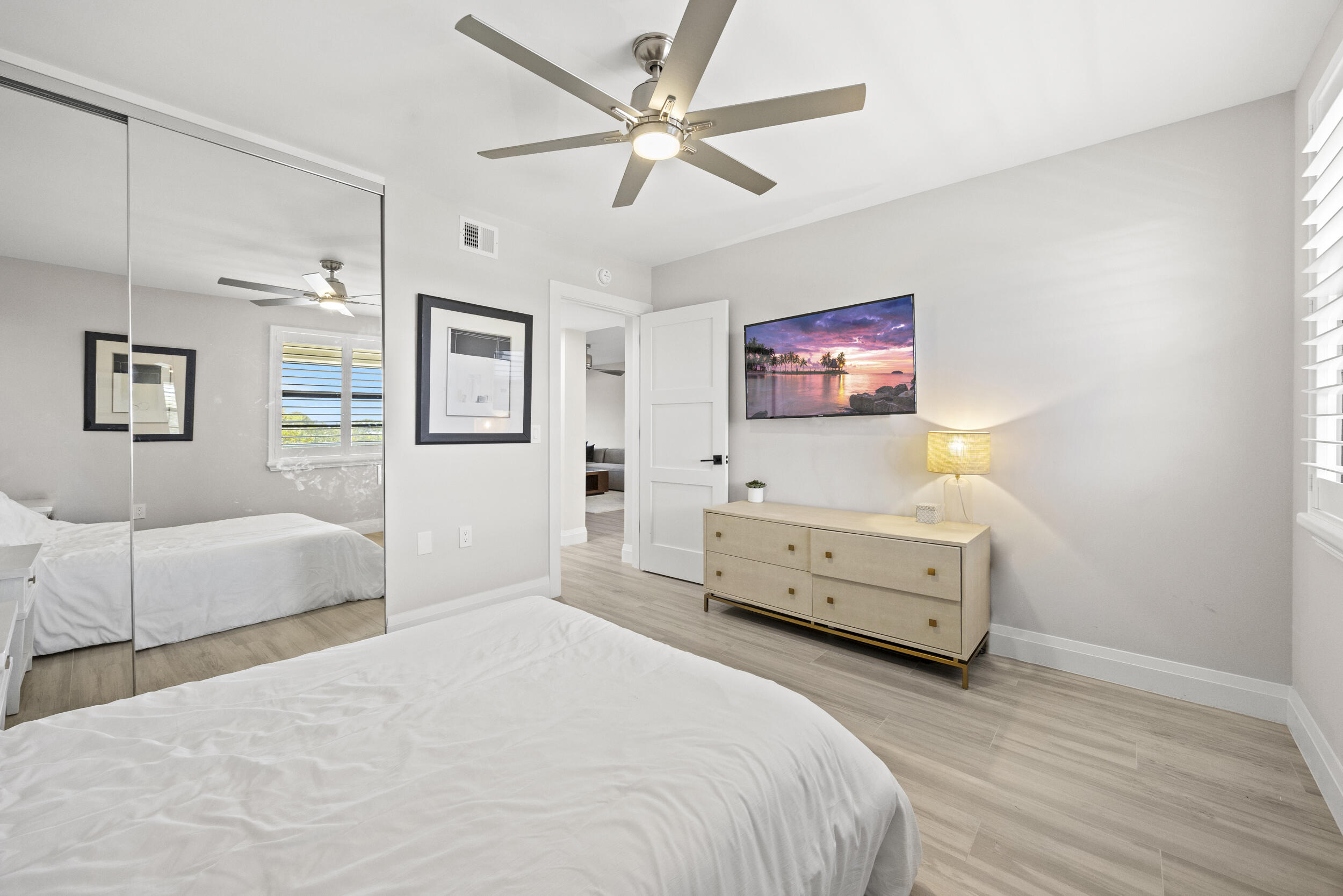 6061 Balboa Circle, Unit 403 Boca Raton, FL 33433 - Photo 31 of 44 a bedroom with a bed and a couch