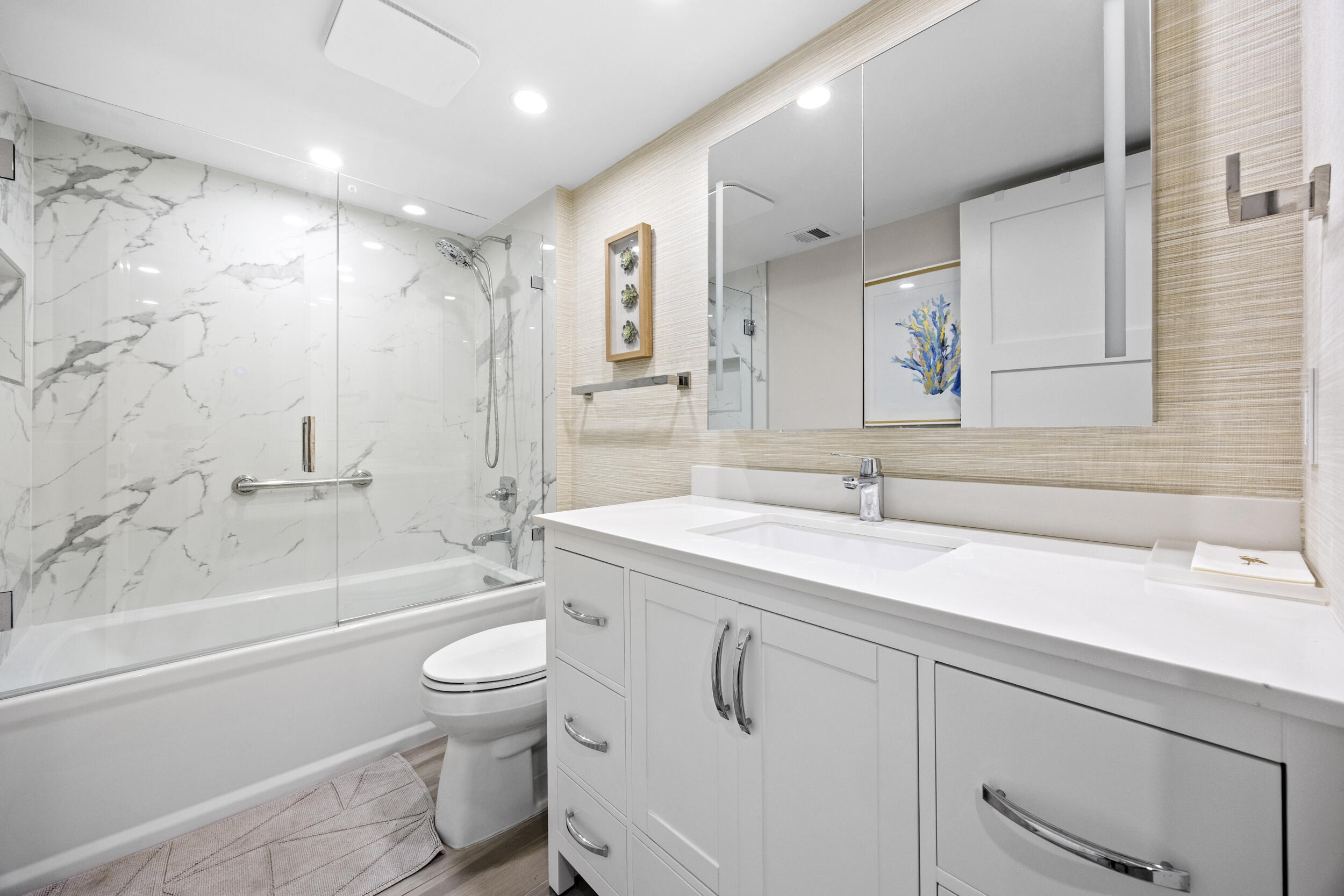 6061 Balboa Circle, Unit 403 Boca Raton, FL 33433 - Photo 32 of 44 a bathroom with a sink a toilet and shower