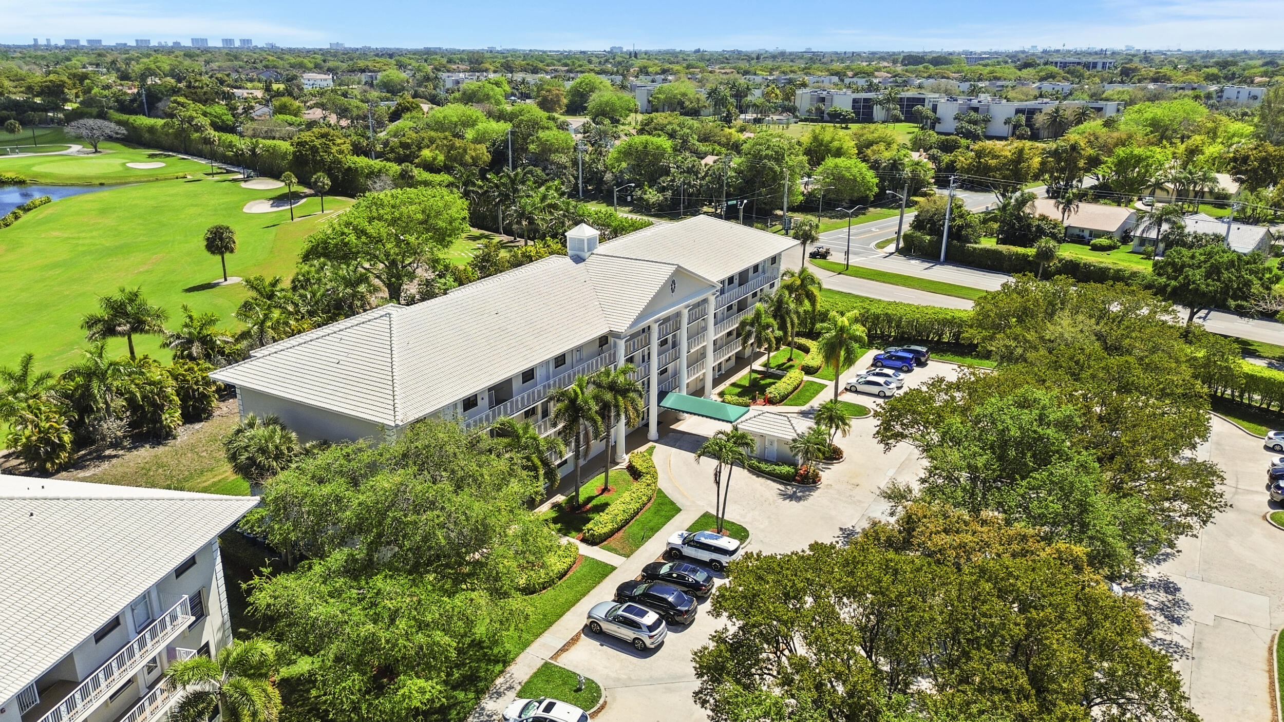 6061 Balboa Circle, Unit 403 Boca Raton, FL 33433 - Photo 38 of 44 an aerial view of a house with yard swimming pool and outdoor seating