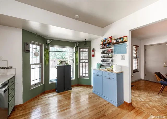a kitchen with stainless steel appliances a refrigerator and a stove top oven