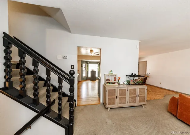 a view of a livingroom with workspace and a window