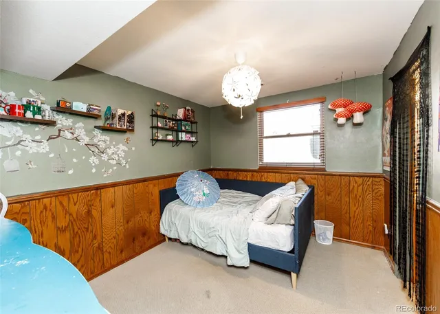 a bedroom with bed and a window