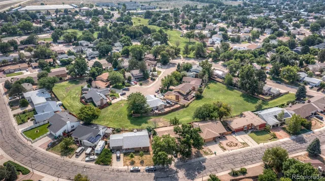 an aerial view of residential houses with outdoor space