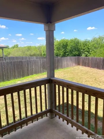 a view of a yard with a fence