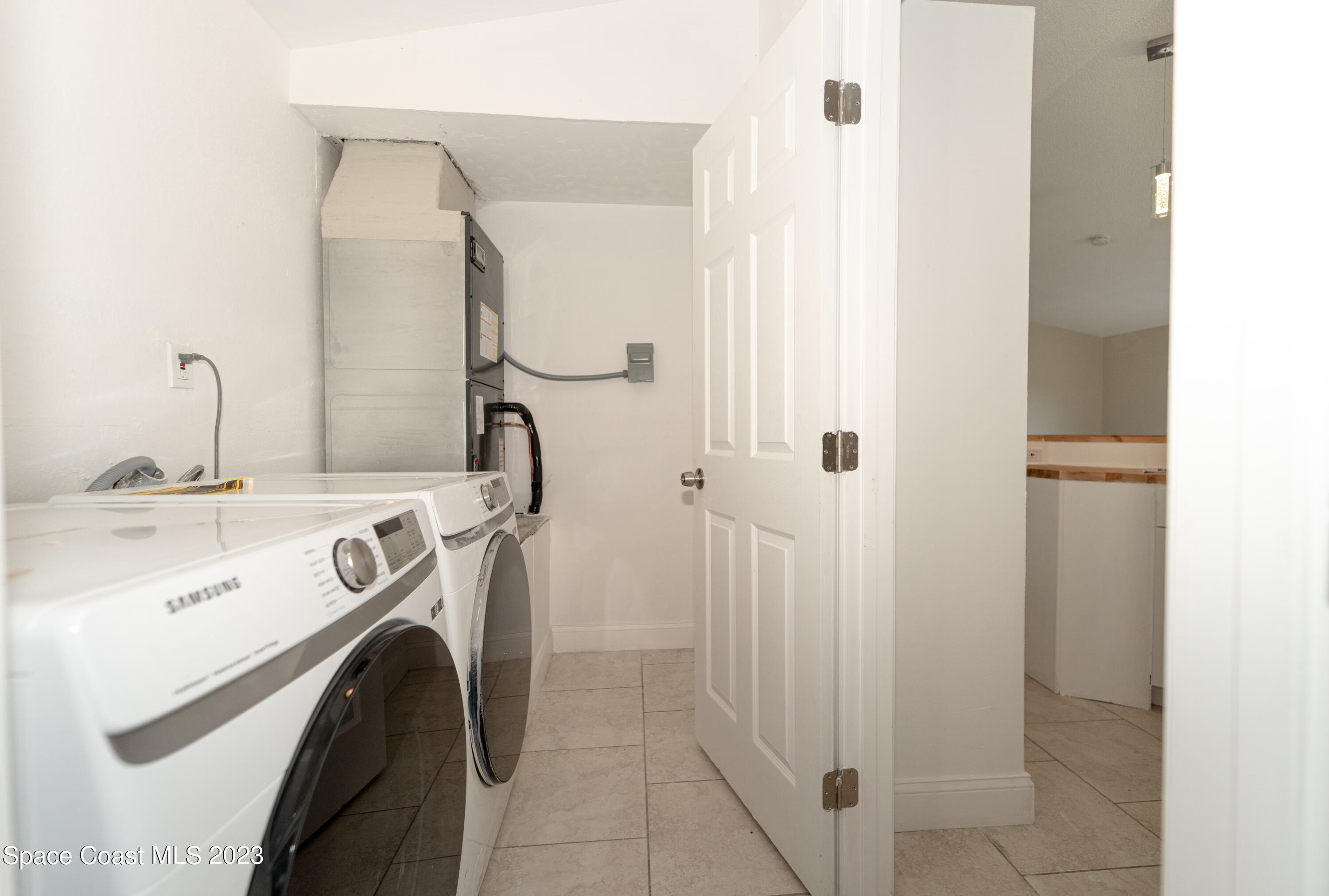 215 Trilby Road Southwest Palm Bay, FL 32908 - Photo 17 of 19 a utility room with dryer and washer