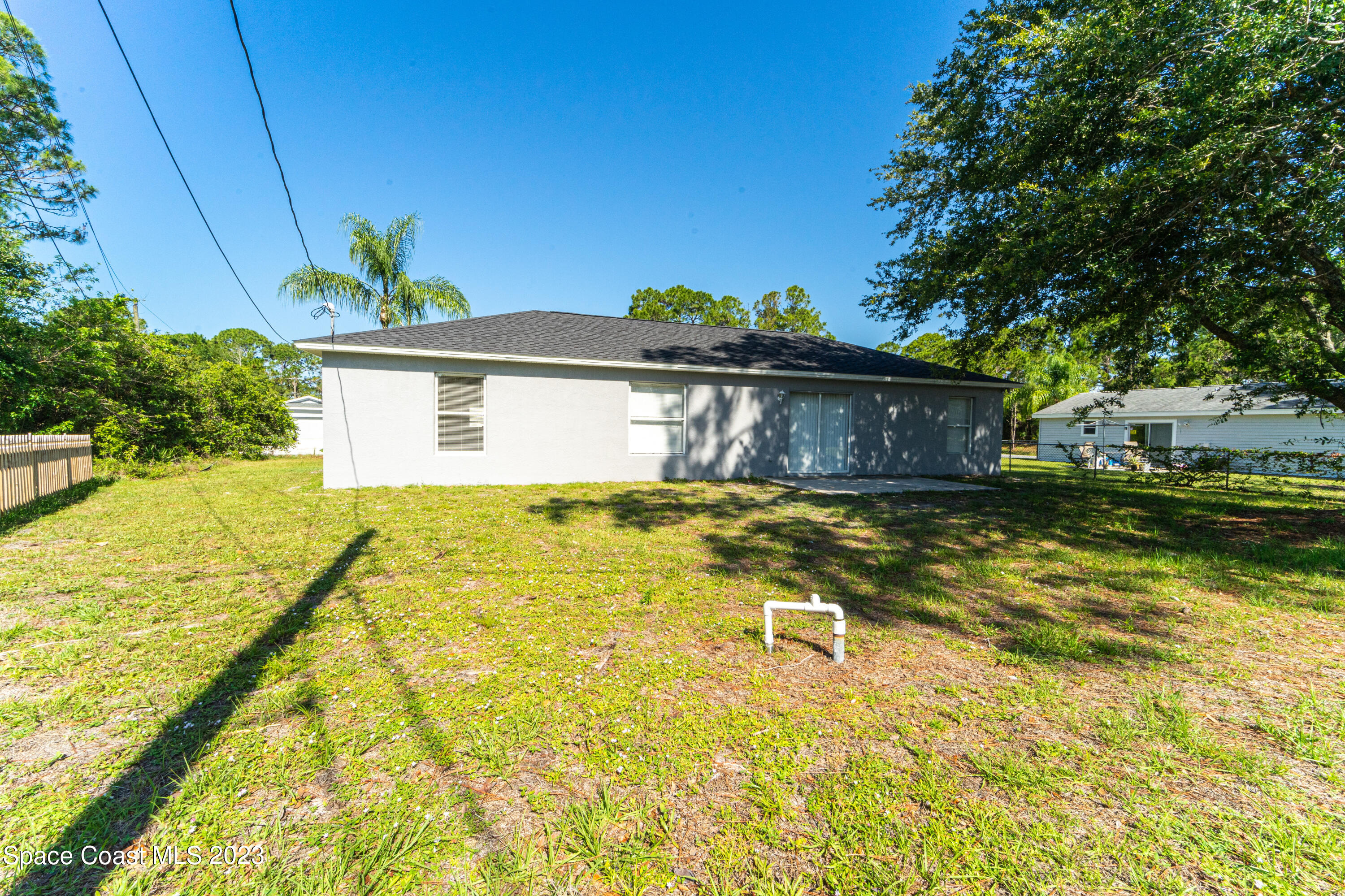 215 Trilby Road Southwest Palm Bay, FL 32908 - Photo 18 of 19 a house view with swimming pool in front of it