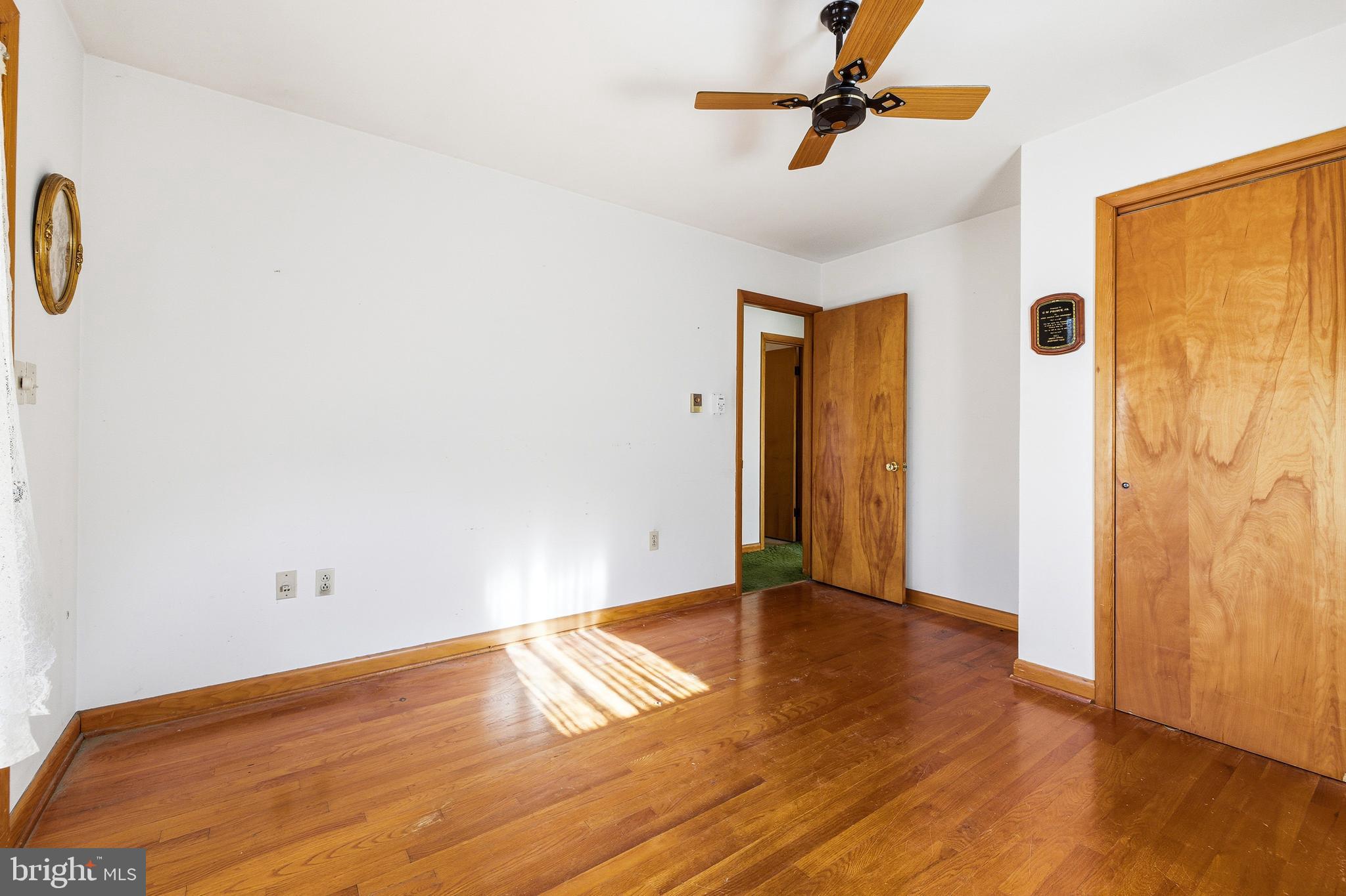 115 Sunset Drive Stanley, VA 22851 - Photo 17 of 56 a view of a livingroom with wooden floor and a ceiling fan
