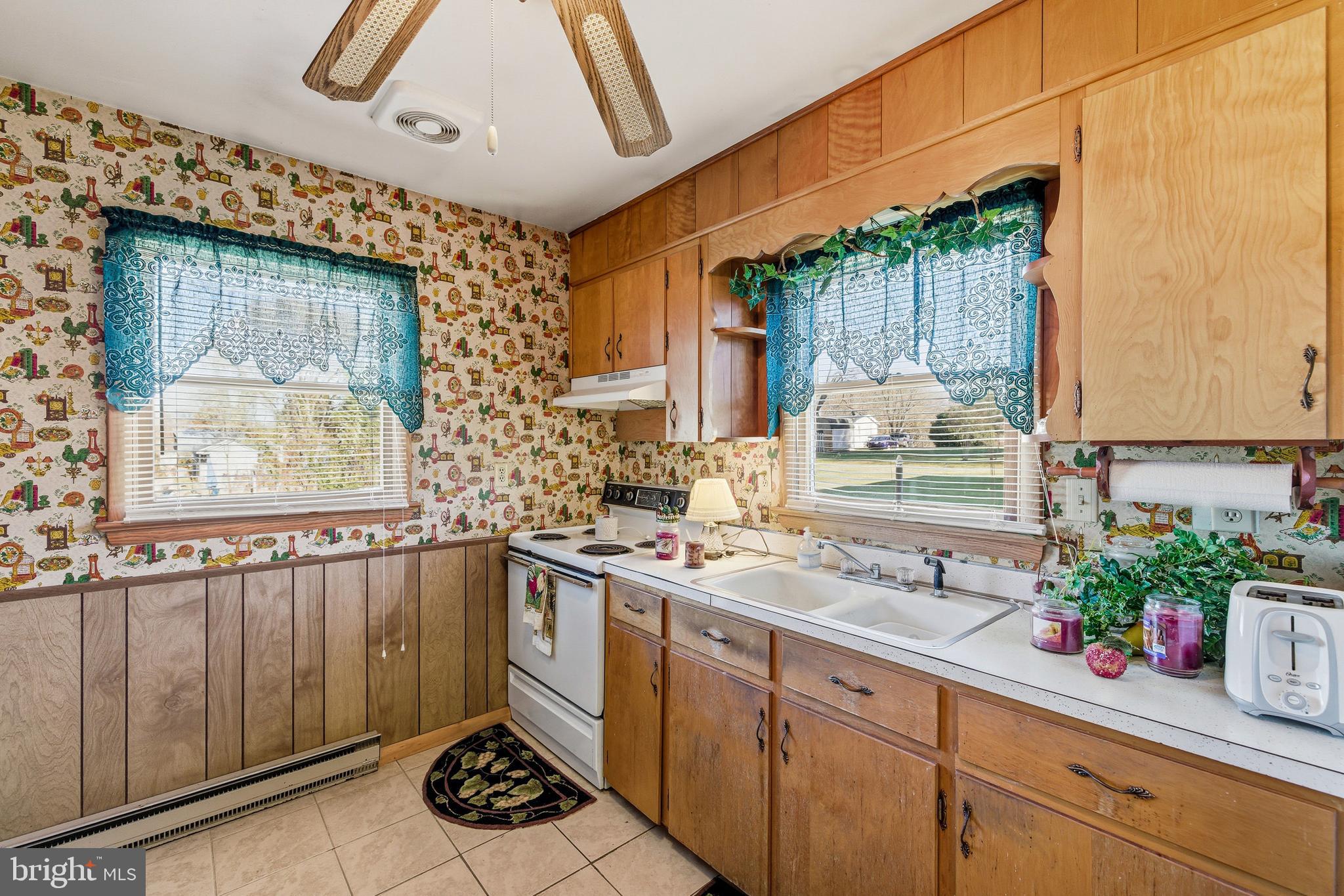 115 Sunset Drive Stanley, VA 22851 - Photo 4 of 56 a kitchen with a sink stove and cabinets