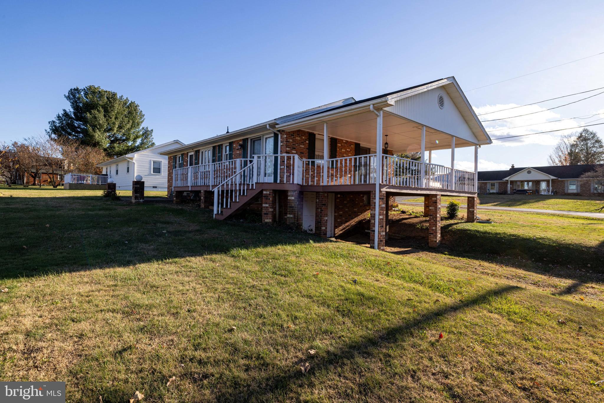 115 Sunset Drive Stanley, VA 22851 - Photo 43 of 56 a view of a house with backyard and sitting area