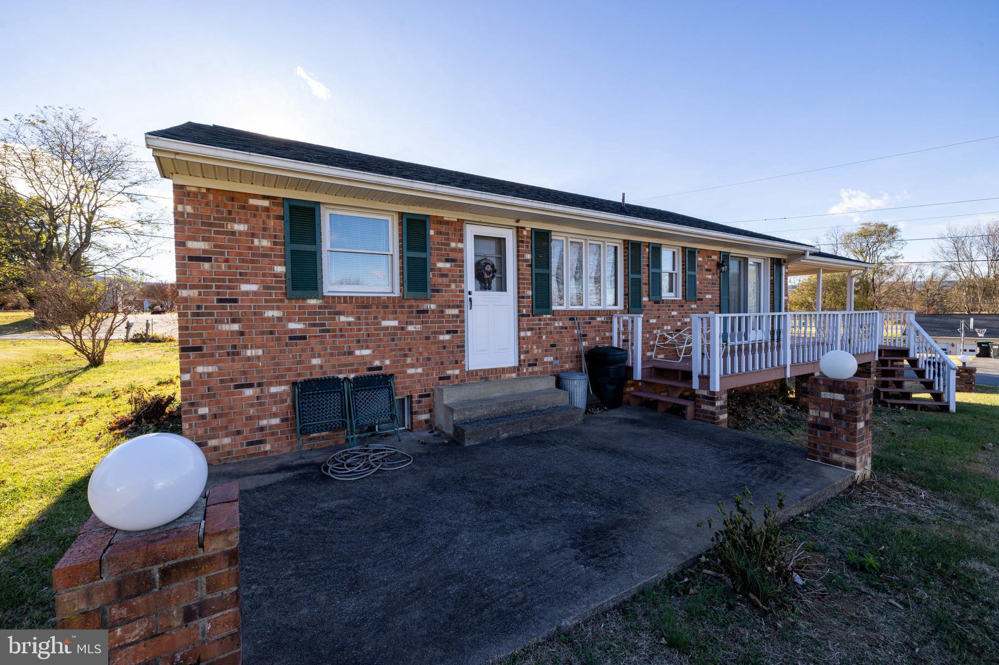115 Sunset Drive Stanley, VA 22851 - Photo 45 of 56 a view of house with backyard outdoor seating and green space