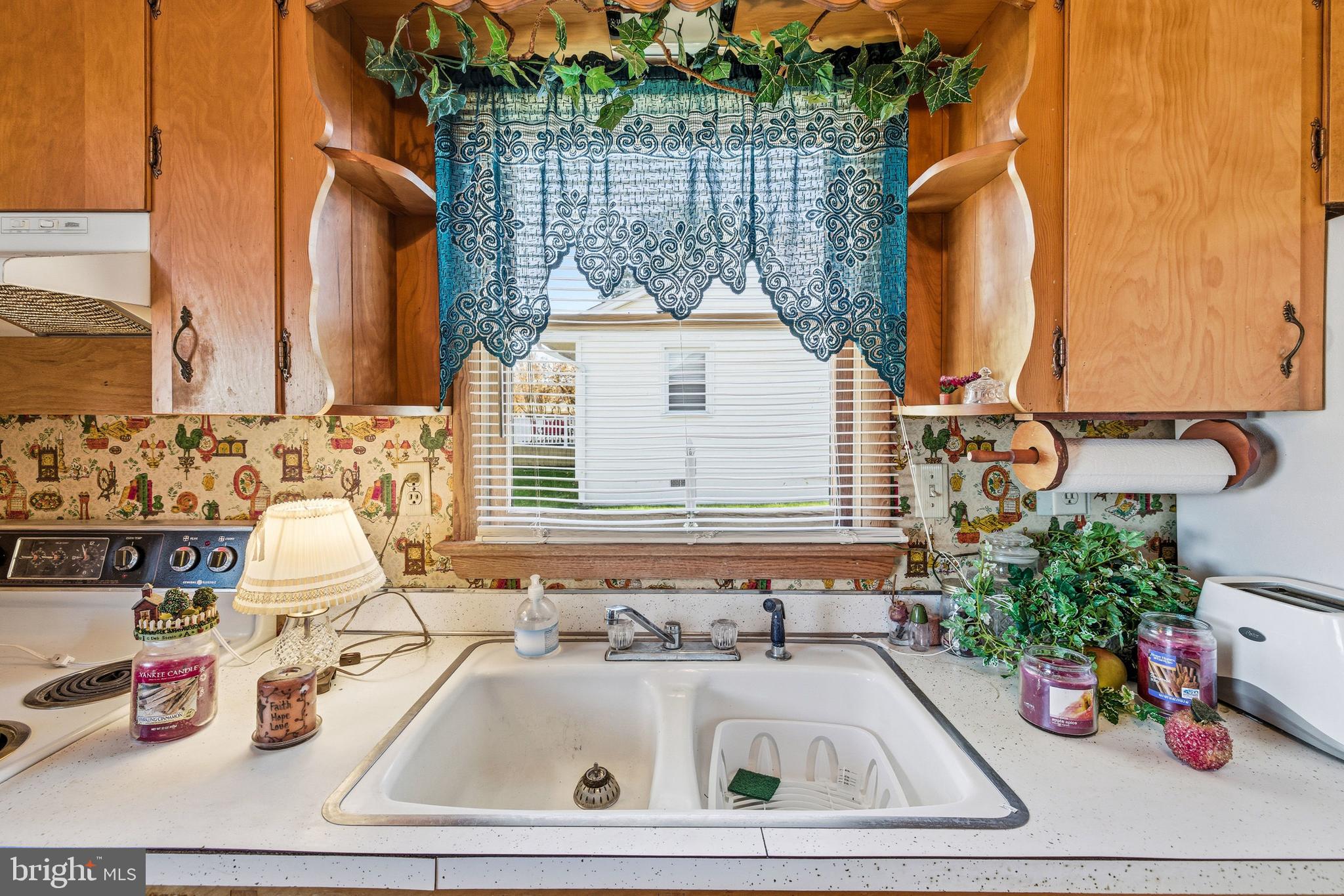 115 Sunset Drive Stanley, VA 22851 - Photo 8 of 56 a bathroom with a sink and a window