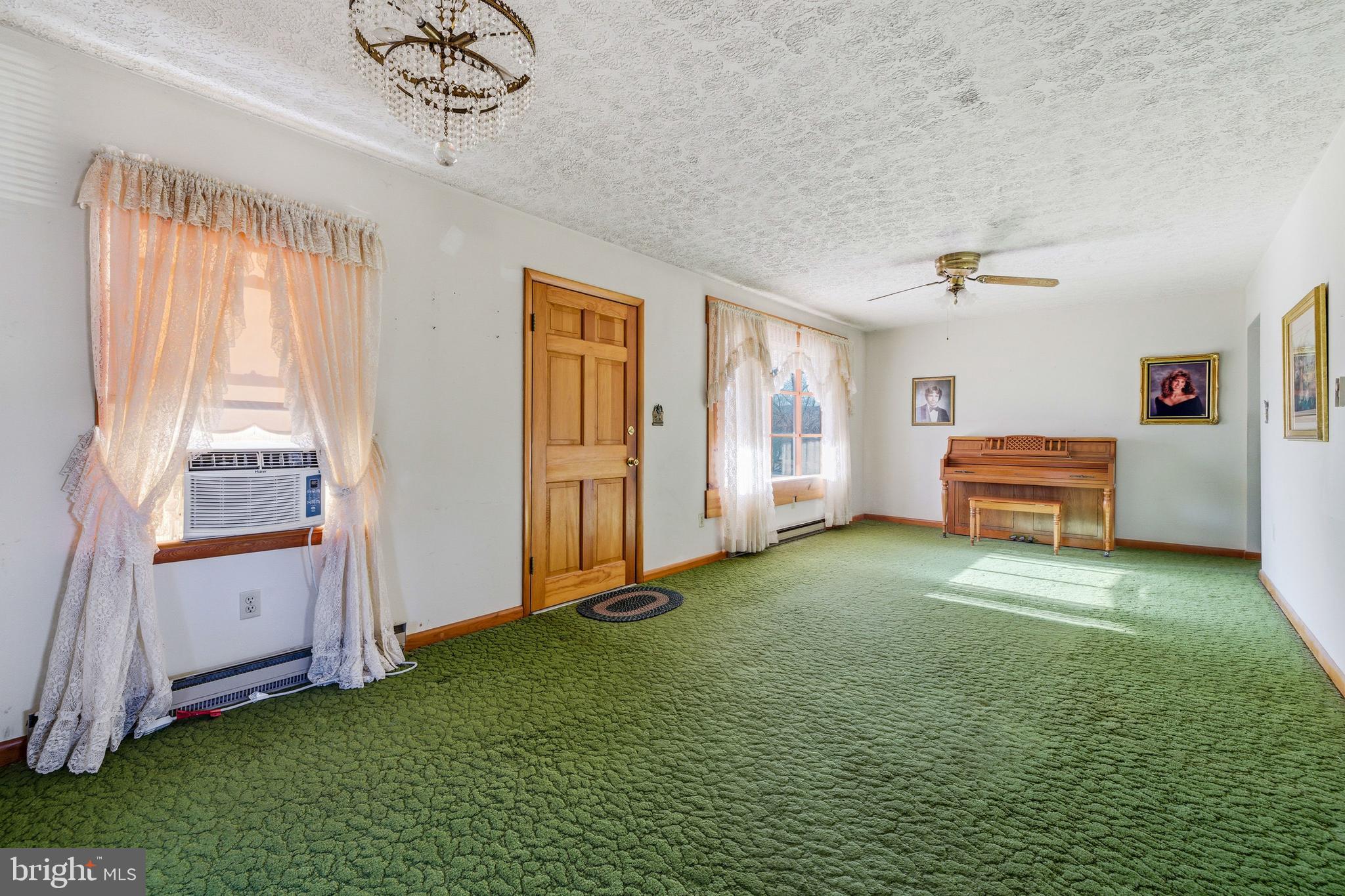 115 Sunset Drive Stanley, VA 22851 - Photo 10 of 56 a living room with furniture and a baby crib