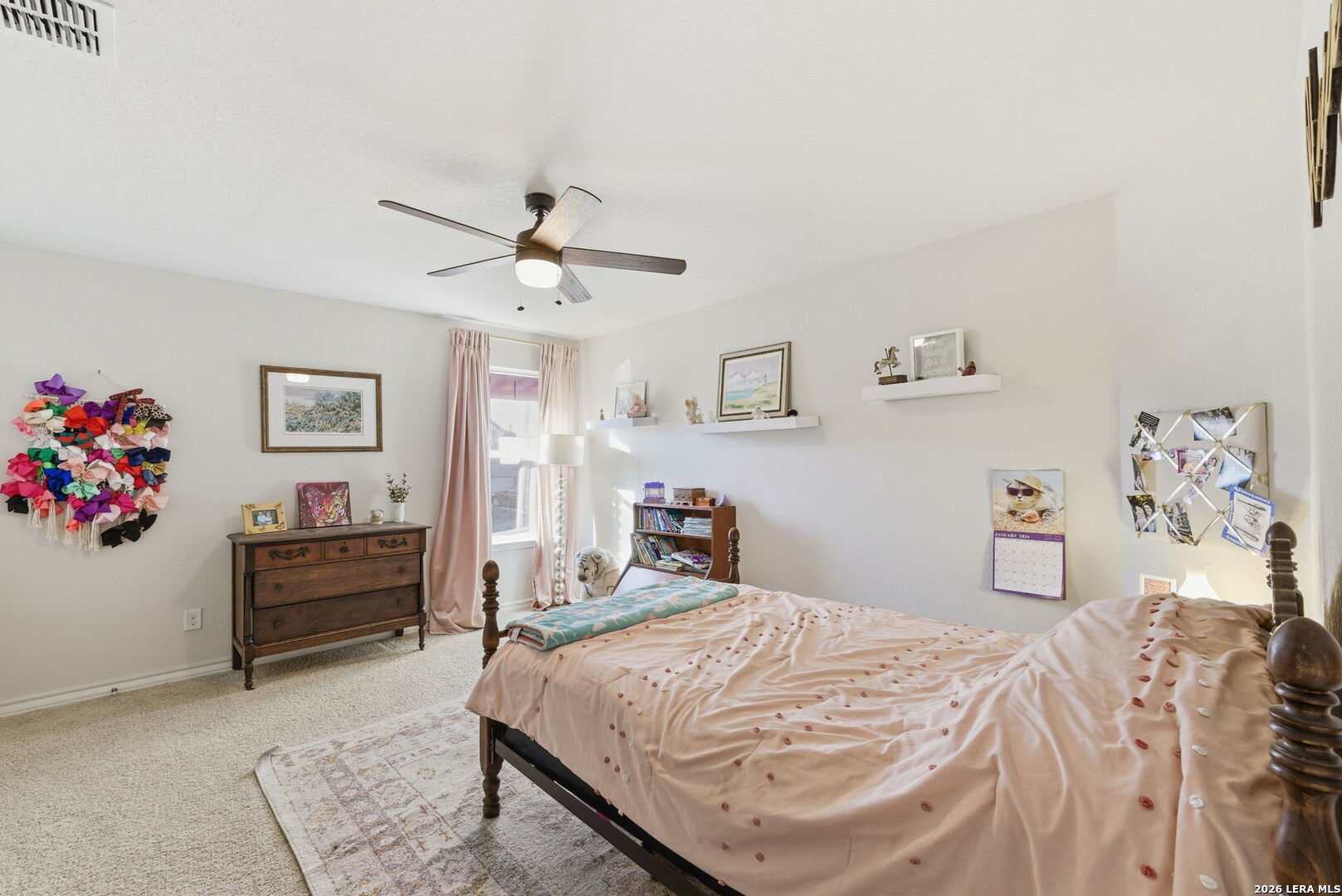 3410 Copper Acres Bulverde, TX 78163 - Photo 26 of 50 a bedroom with a bed and a chandelier