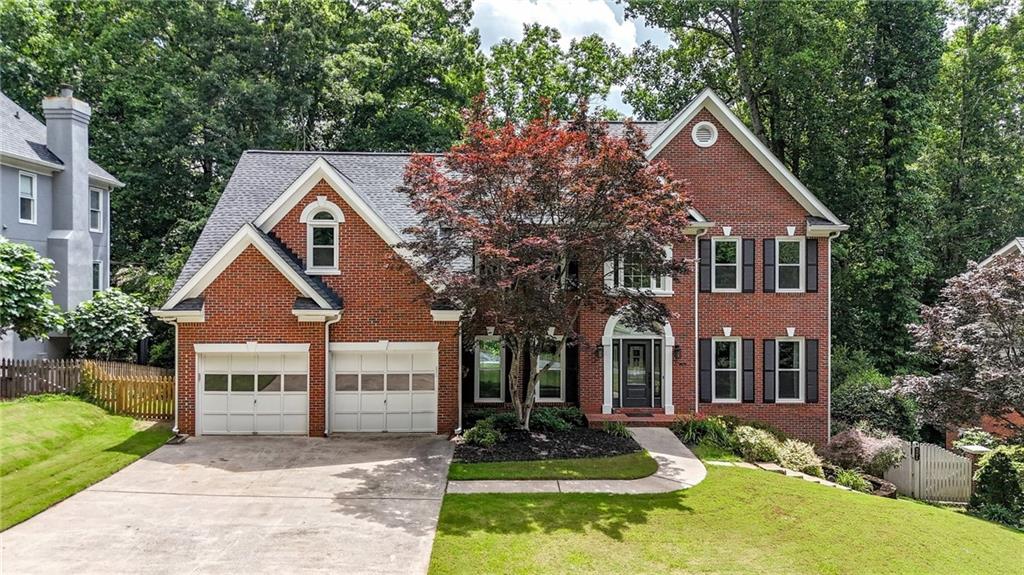 4955 Day Lily Way Acworth, GA 30102 - Photo 1 of 1 a front view of a house with a yard and garage