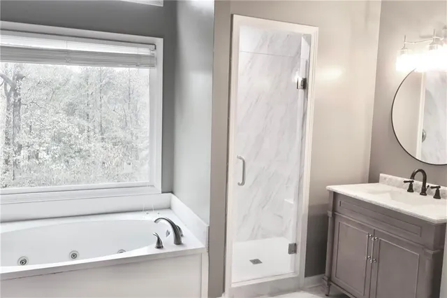 a bathroom with a bathtub and window