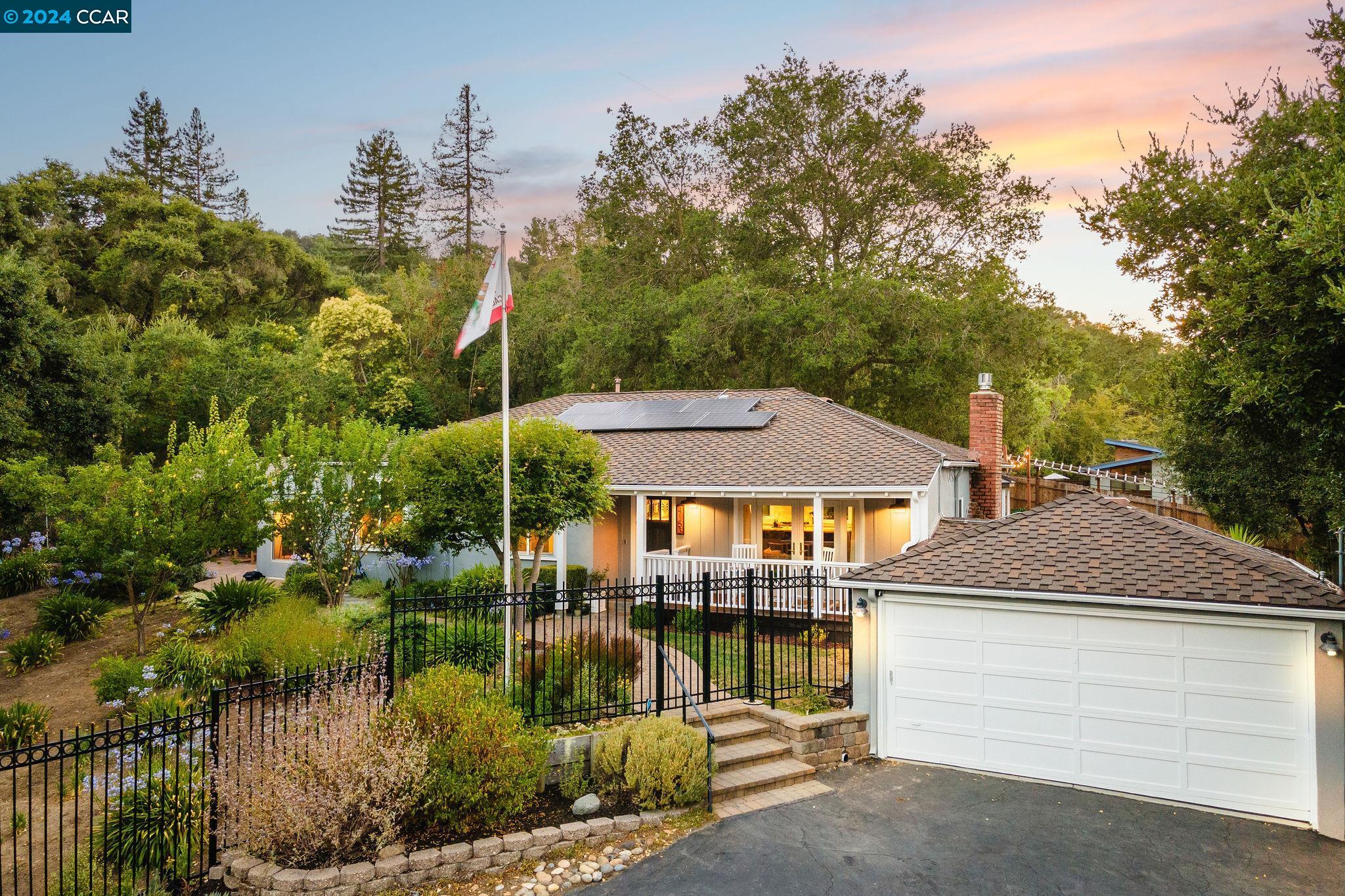 4153 Hidden Valley Road Lafayette, CA 94549 - Photo 1 of 1 a aerial view of a house with a yard table and chairs