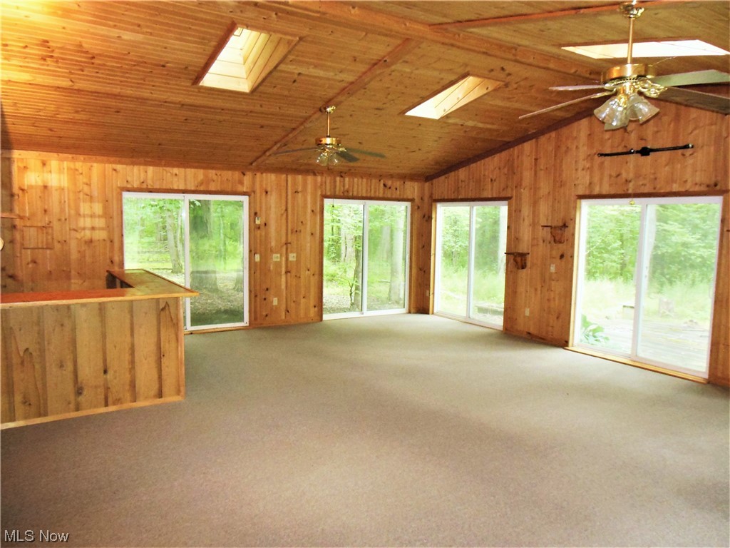 6669 Sidley Road Thompson, OH 44086 - Photo 13 of 18 Expansive Sunroom w/ Bar