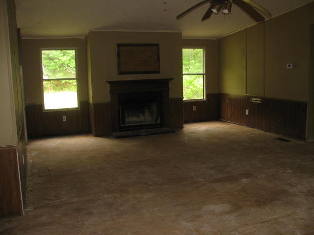 599 Rocky Creek Road Forsyth, GA 31029 - Photo 3 of 9 a view of empty room with a fireplace
