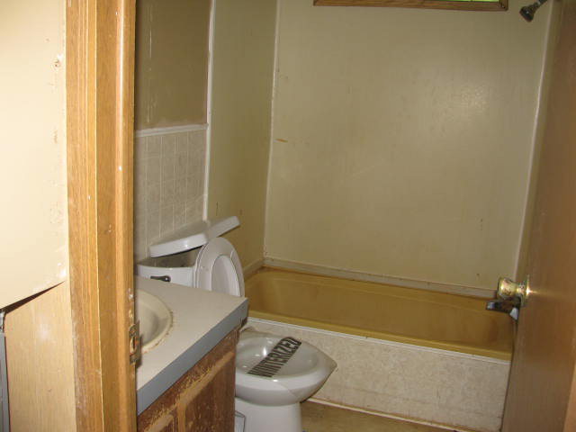 599 Rocky Creek Road Forsyth, GA 31029 - Photo 7 of 9 a bathroom with a tub and a sink