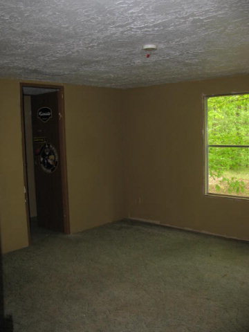 599 Rocky Creek Road Forsyth, GA 31029 - Photo 8 of 9 an empty room with a window