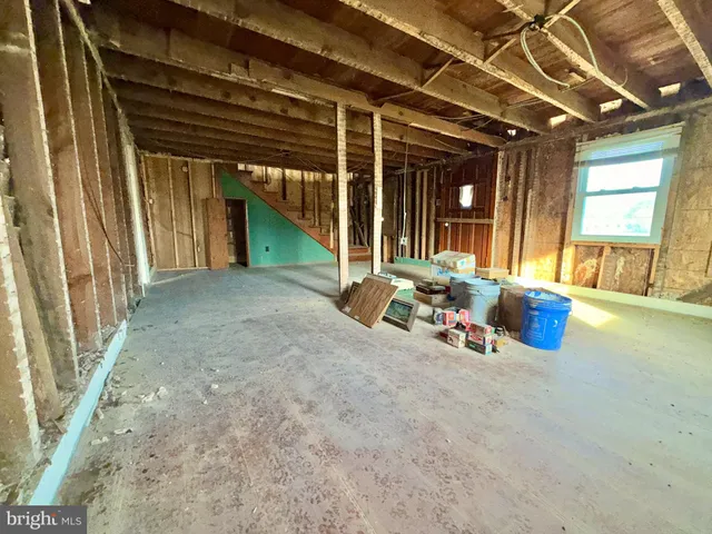 a view of a room with furniture and window